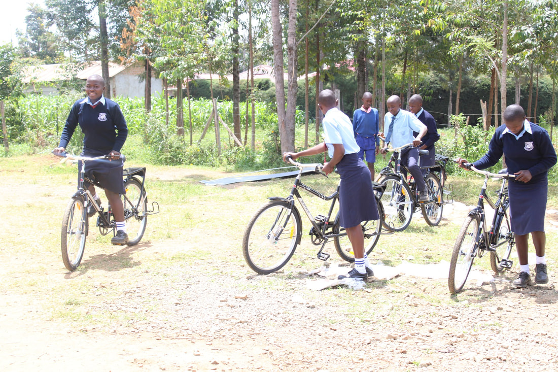 Rural students receiving bicycles from the Riley Orton Foundation