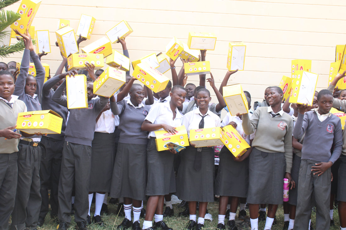 Students receiving new school shoes