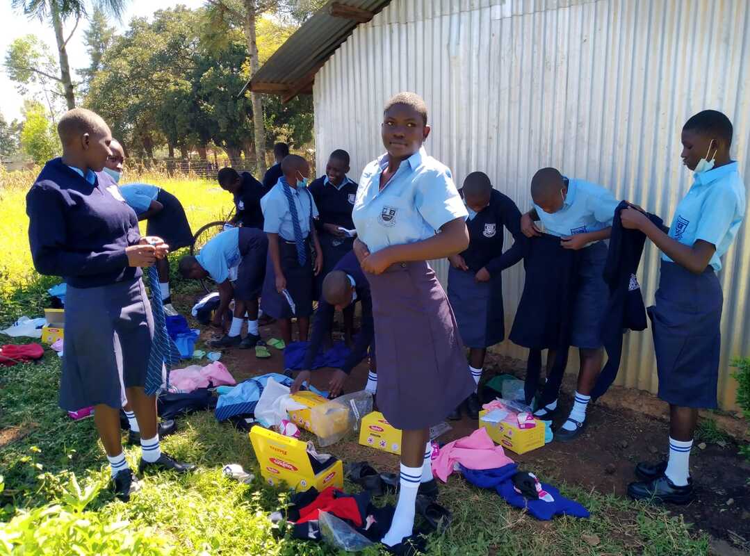 Girls trying on their new school clothes and shoes