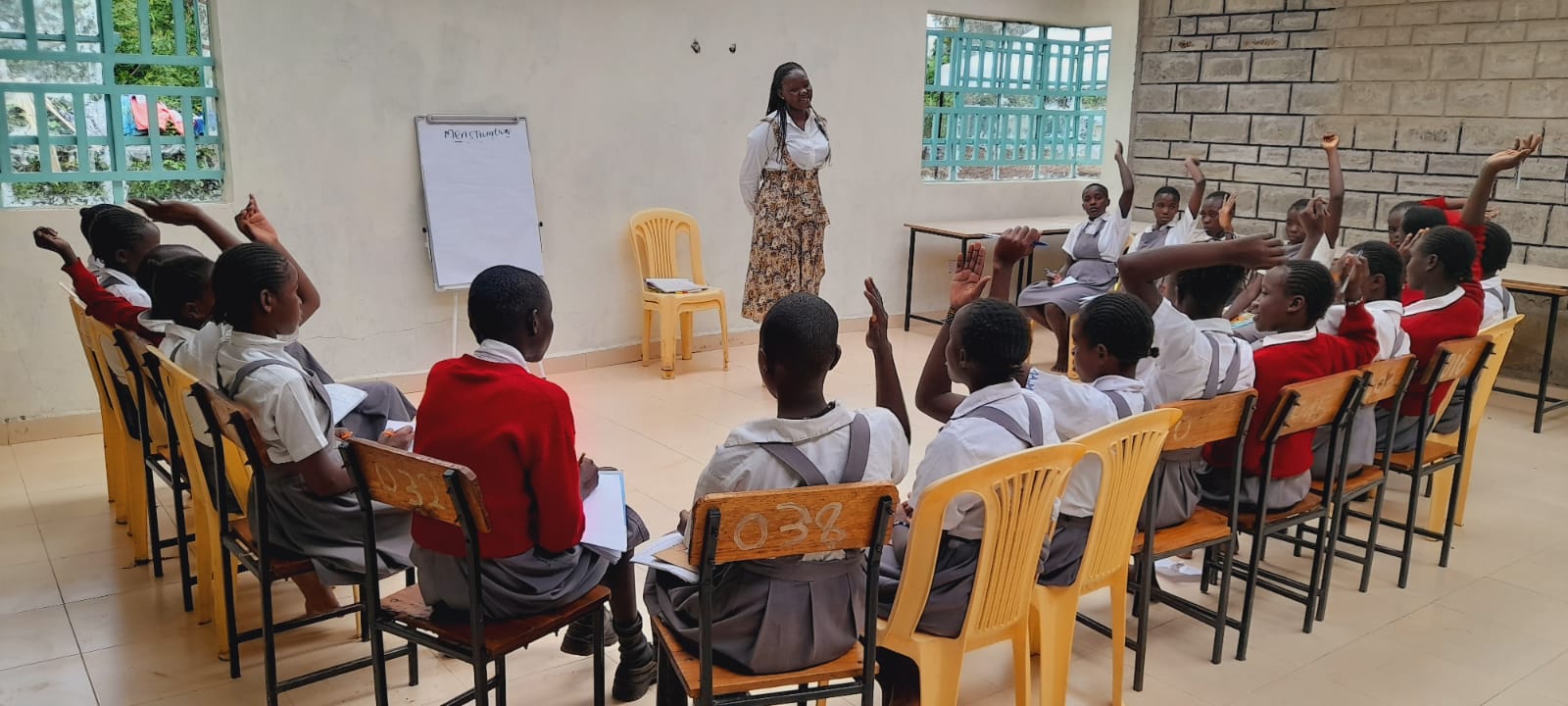 Primary school girls sitting in a circle for a talk session