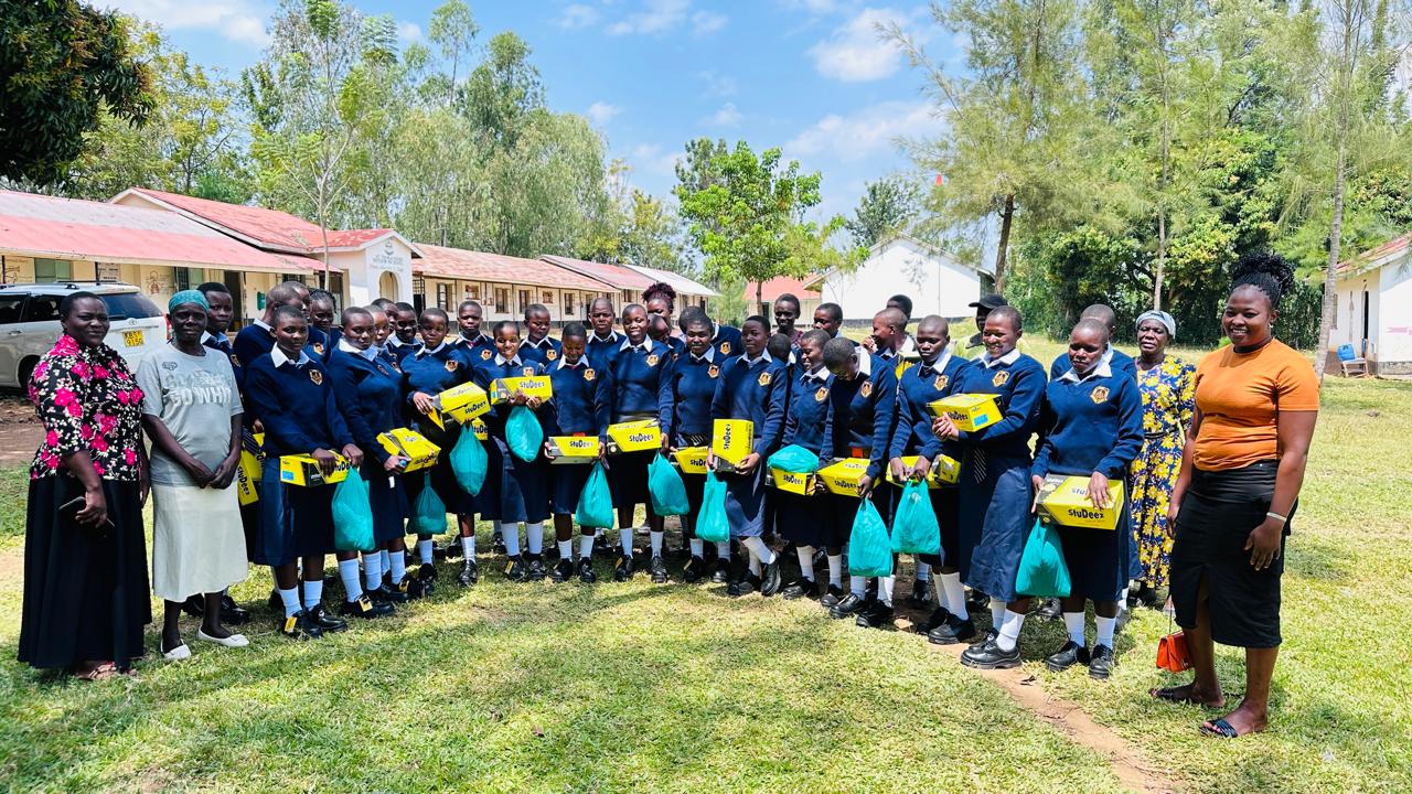 Students receiving new school uniforms
