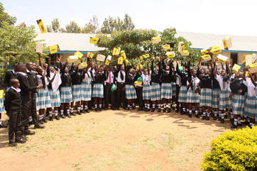 Students receiving school uniforms